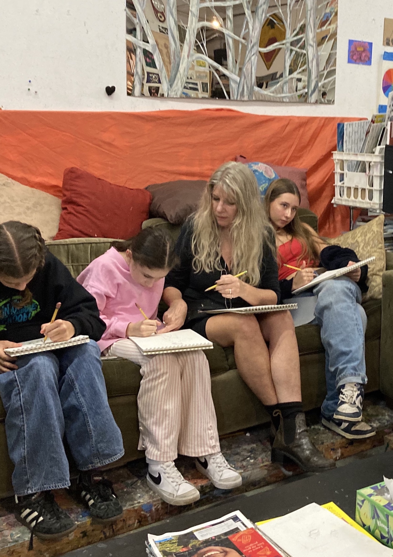 A group of people sitting on top of a couch.