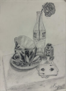 A drawing of a cup and bottle on the table