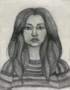 A pencil drawing of a woman with long hair.