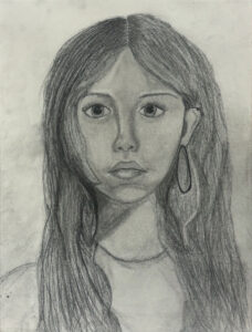 A pencil drawing of a girl with long hair.