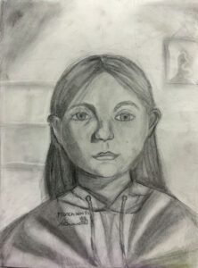 A pencil drawing of a girl with long hair.