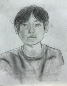 A pencil drawing of a young person with short hair.