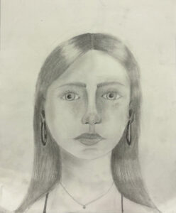 A pencil drawing of a woman with long hair.