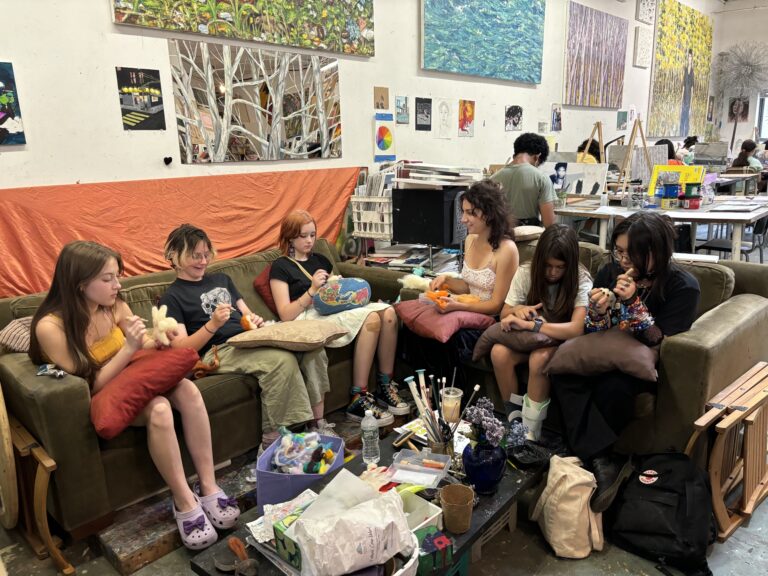 A group of people sitting on top of a couch.