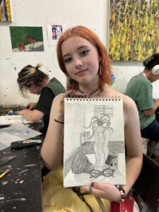 Teen shows still life pencil drawing.