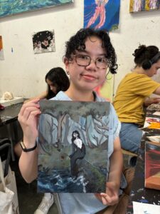 Student showing dark fantasy painting.