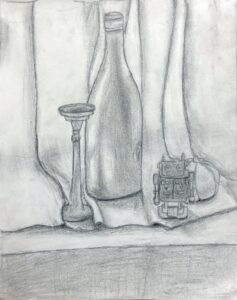 Charcoal sketch of a bottle, candlestick, and small camera on a table.