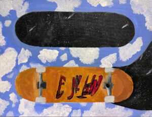 Two skateboards on a blue sky with clouds background.