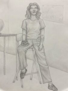 Pencil sketch of a person sitting on a stool with a relaxed pose.