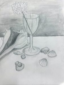 Pencil sketch of a wine glass with scattered seashells and a napkin.